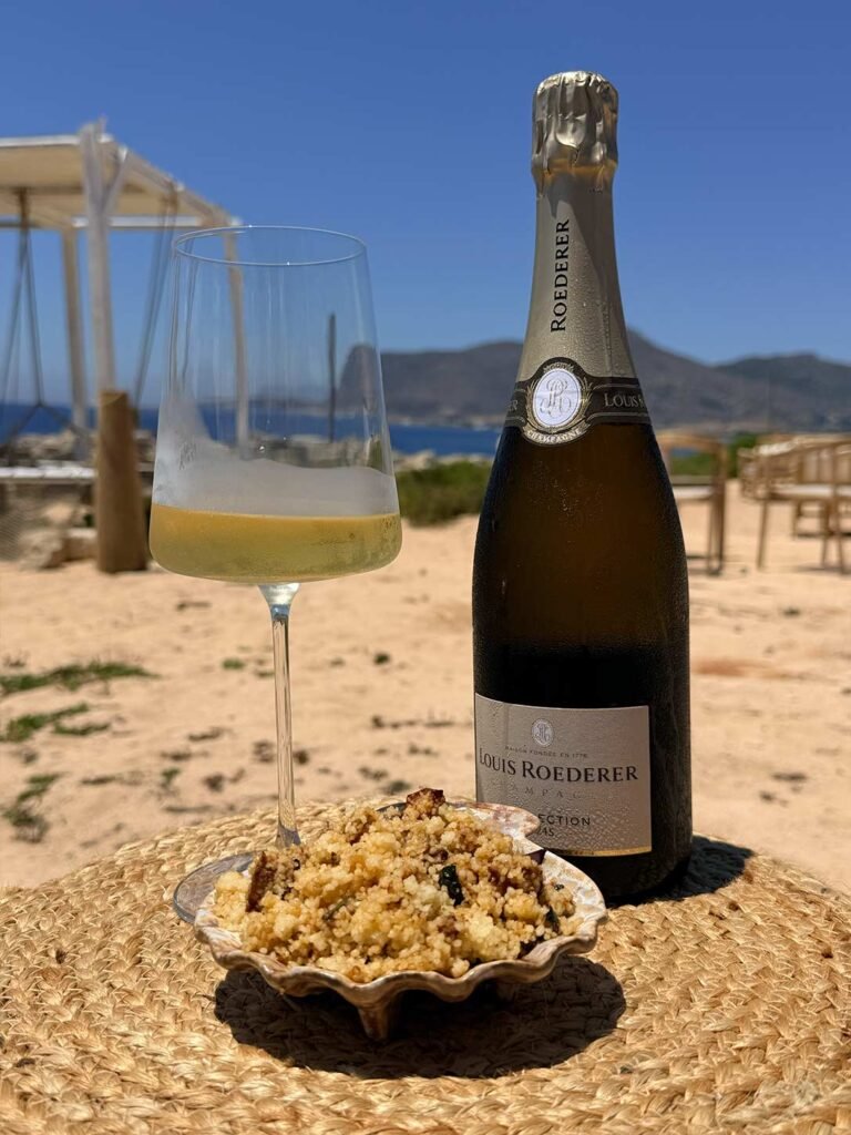 Calice di champagne e cuscus di mare da Fenix Favignana